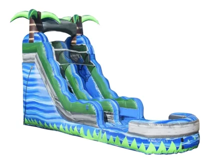 Tropical-themed inflatable water slide with palm trees, wave design, and splash pool. Perfect for summer fun. Buy this high-quality slide online today!