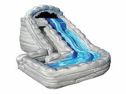 Shark-themed inflatable water slide with realistic gray and blue design, splash pool, and wave details. Perfect for summer fun. Buy online now!