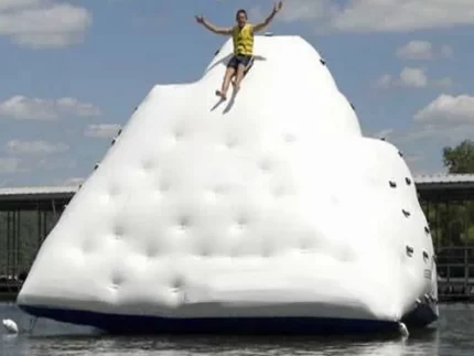 Giant inflatable water climbing iceberg with slide, perfect for summer adventures. Durable, fun, and easy to set up. Buy online for water park fun!