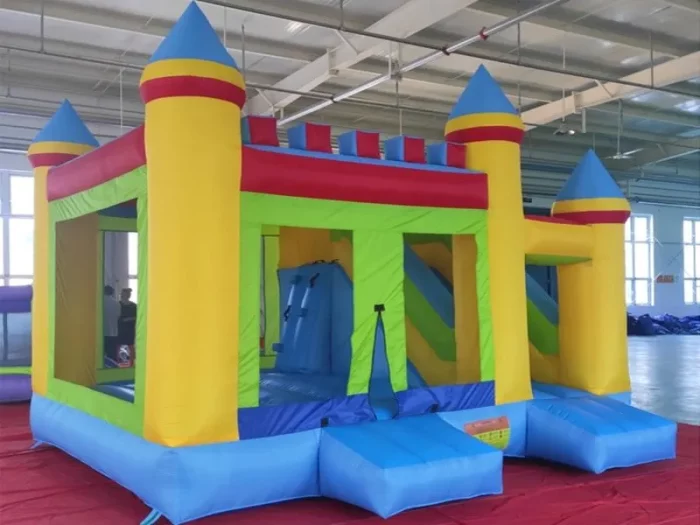 Large castle-themed inflatable bounce house with slide and climbing wall, perfect for parties. Bright, durable, and fun. Buy online for endless entertainment!